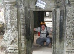 Daniel peering from behind ancient ruins