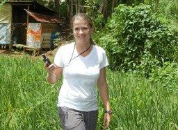 Mary standing in overgrown rural area