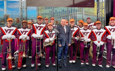 Alexandria University President Abdelaziz Konsowa poses for a photo with the Marching Virginians.